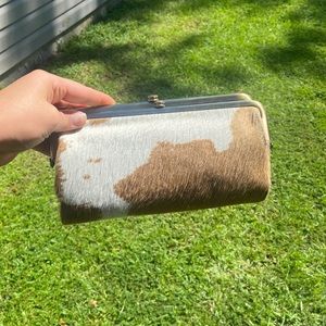 HOBO tan cow print wallet with magnetic closure. Great condition.